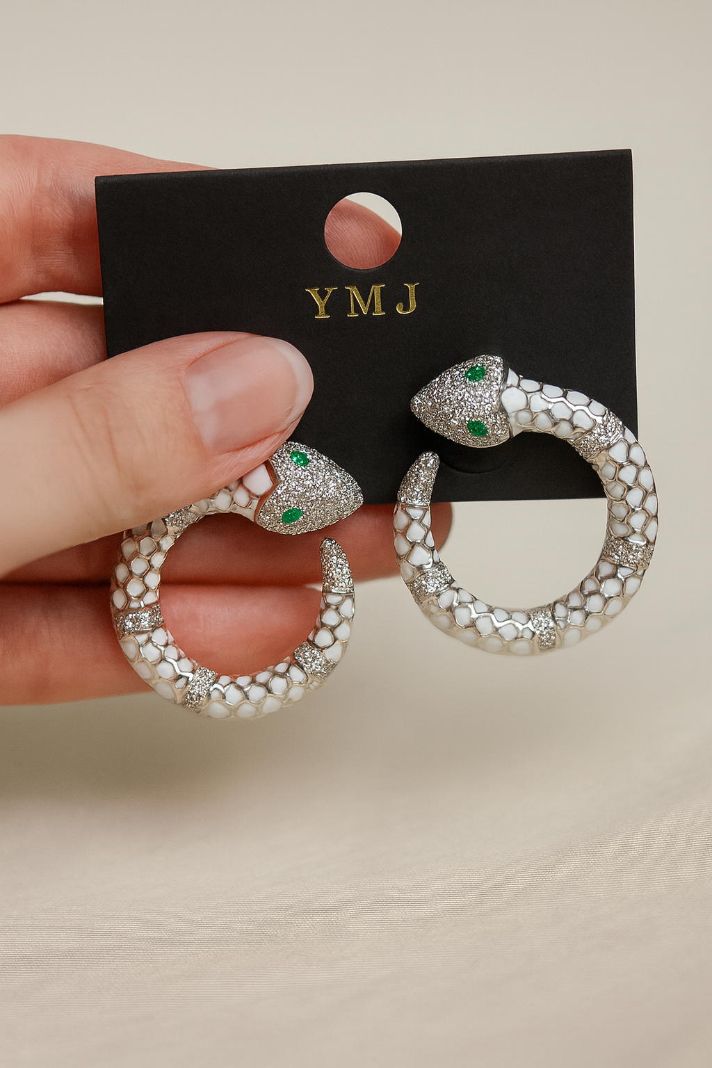 White Enamel Snake Hoop Earrings with Green Crystal Eyes β Luxury Statement Jewelry