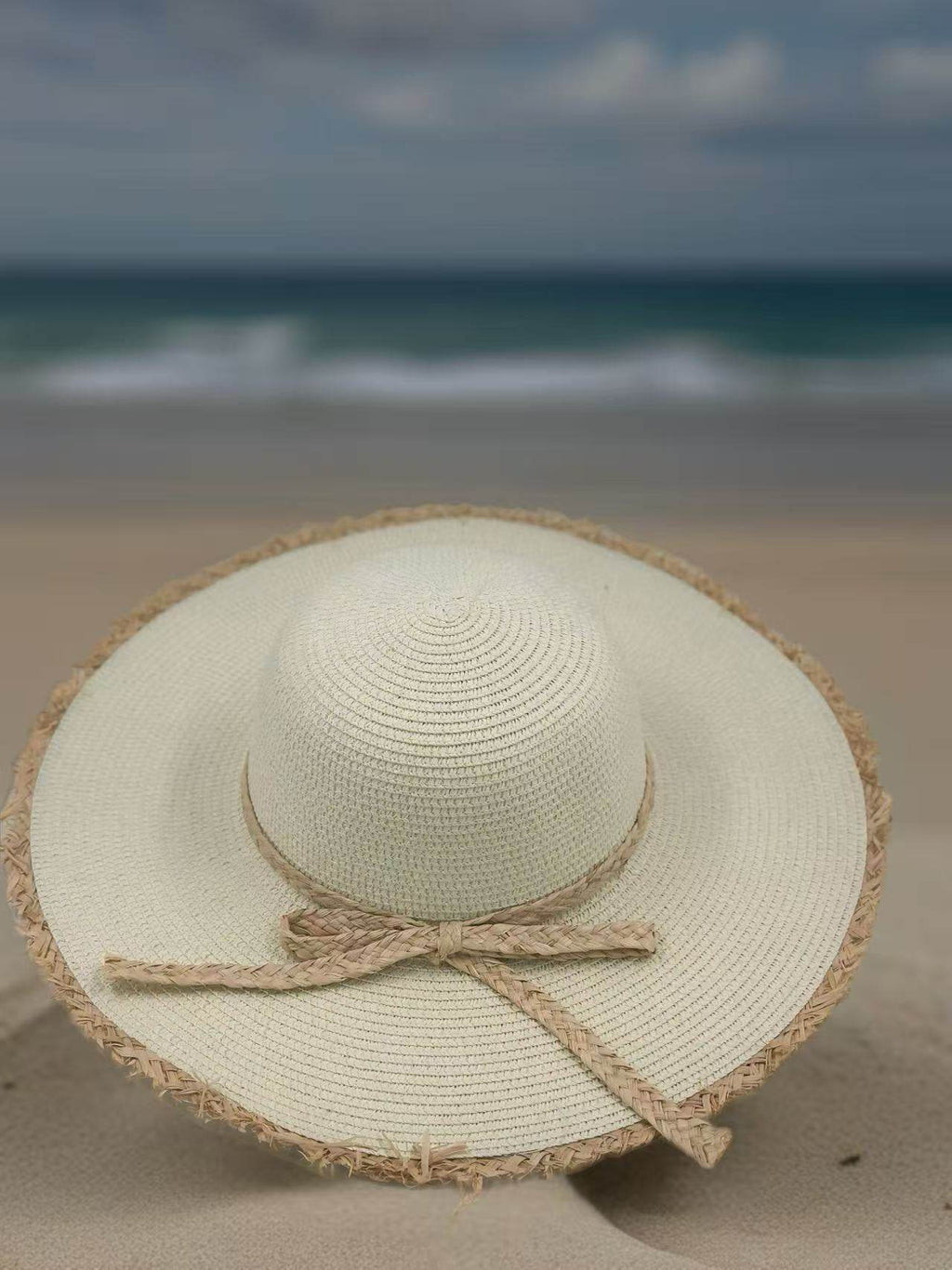Ivory Wide-Brim Hat with Braided Straw Bow and Fringed Edge - MODA ACCESSORIES