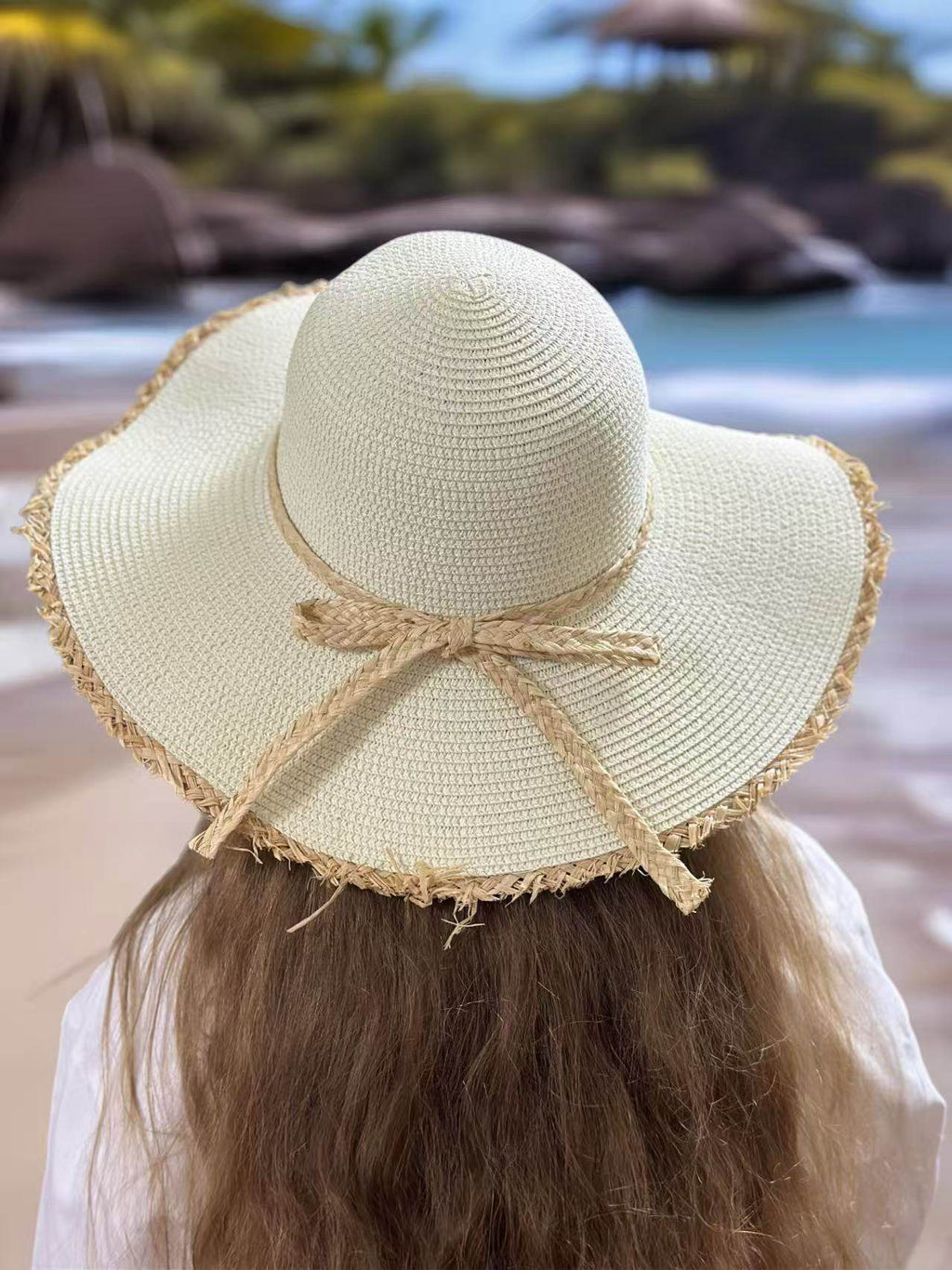 Ivory Wide-Brim Hat with Braided Straw Bow and Fringed Edge - MODA ACCESSORIES