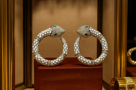 White Enamel Snake Hoop Earrings with Green Crystal Eyes – Luxury Statement Jewelry
